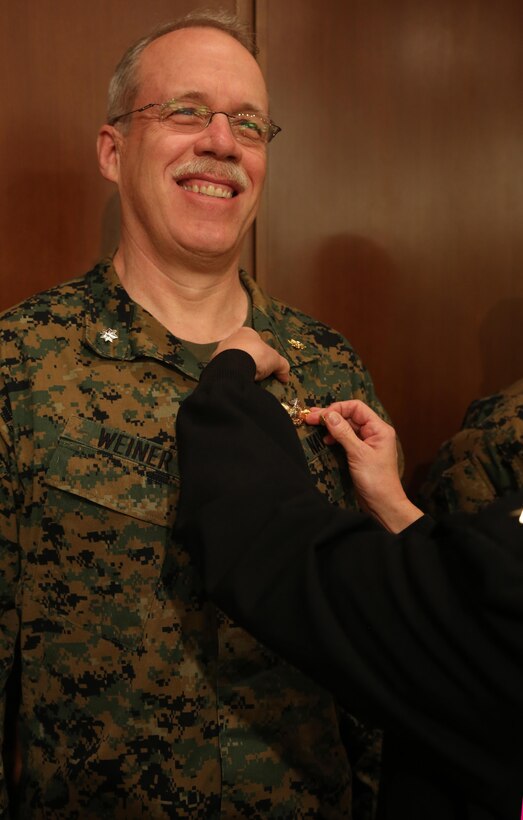 Cmdr. Timothy M. Weiner receives his Fleet Marine Force pin during the annual Marine Forces Reserve Surgeon’s Training Conference, Feb 19, 2016, at Marine Corps Support Facility New Orleans. Only sailors attached to forward-deployable Marine units are eligible to earn the FMF pin. (U.S. Marine Corps photo by Sgt. Brytani Musick)