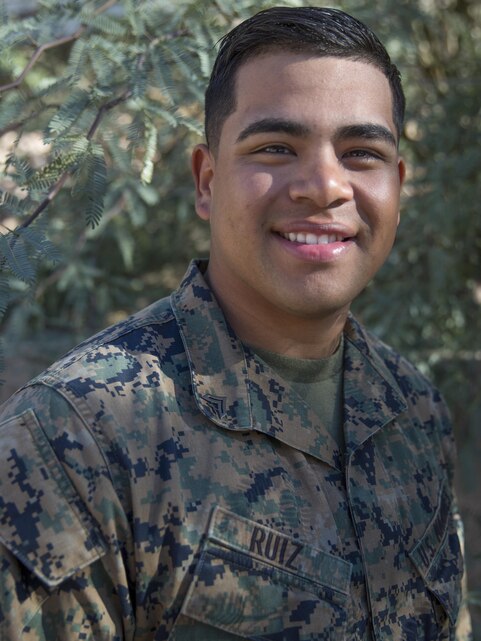 Cpl. Brandon Ruiz, landing support specialist, Combat Logistics Battalion 7, poses for a photograph aboard the Marine Corps Air Ground Combat Center, Twentynine Palms, Calif., Feb. 16, 2016. He plays outside linebacker for his unit's football team. He began playing football in the fourth grade and was drawn to the sense of brotherhood that came from working as a team. (Official Marine Corps photo by Lance Cpl. Levi Schultz/Released)