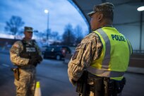 Sgt. Michael Villena (right), U.S. Army Reserve military police Soldier from Manassas Park, Va., with the 352nd MP Company, of the 200th MP Command, talks with Staff Sgt. Micheal Deitz, patrol supervisor for the 289th MP Co., belonging to the 3rd U.S. Infantry Regiment (The Old Guard), during a partnership program giving Army Reserve Soldiers the opportunity to provide law and order, security and patrol support at various active duty installations in the Military District of Washington, D.C., Feb. 17. This partnership pilot program began in early February, placing Army Reserve Soldiers on active duty orders for three weeks while working at Joint Base Myer-Henderson Hall, Fort Lesley J. McNair and the Arlington National Cemetery. Soldiers will also support the Military District of Washington with additional duty days throughout the year. (U.S. Army photo by Master Sgt. Michel Sauret)