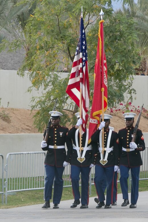 The Combat Center Color Guard carries the national colors and Marine Corps colors during the unveiling ceremony of a veterans’ memorial wall at the Rancho Mirage Community Park, Feb. 14, 2016. (Official Marine Corps photo by Cpl. Thomas Mudd/Released)