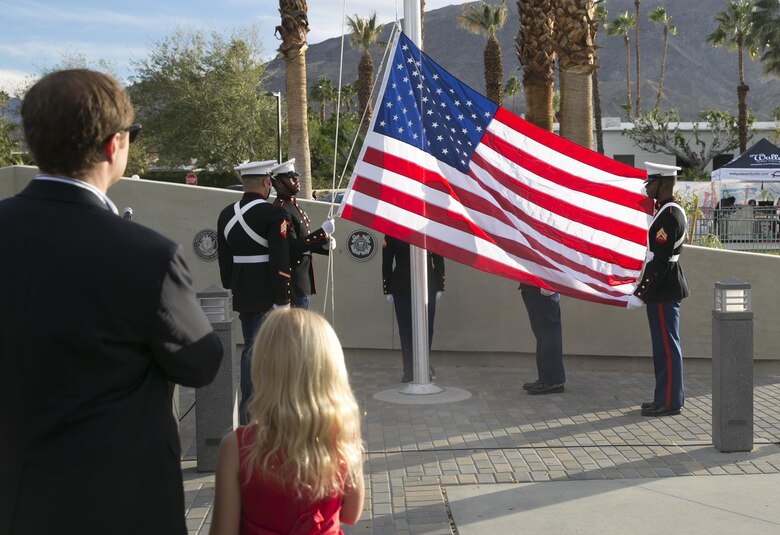 Combat Center Marines raise the national colors during the unveiling ceremony of a veterans’ memorial wall at the Rancho Mirage Community Park, Feb. 14, 2016. (Official Marine Corps photo by Cpl. Thomas Mudd/Released)