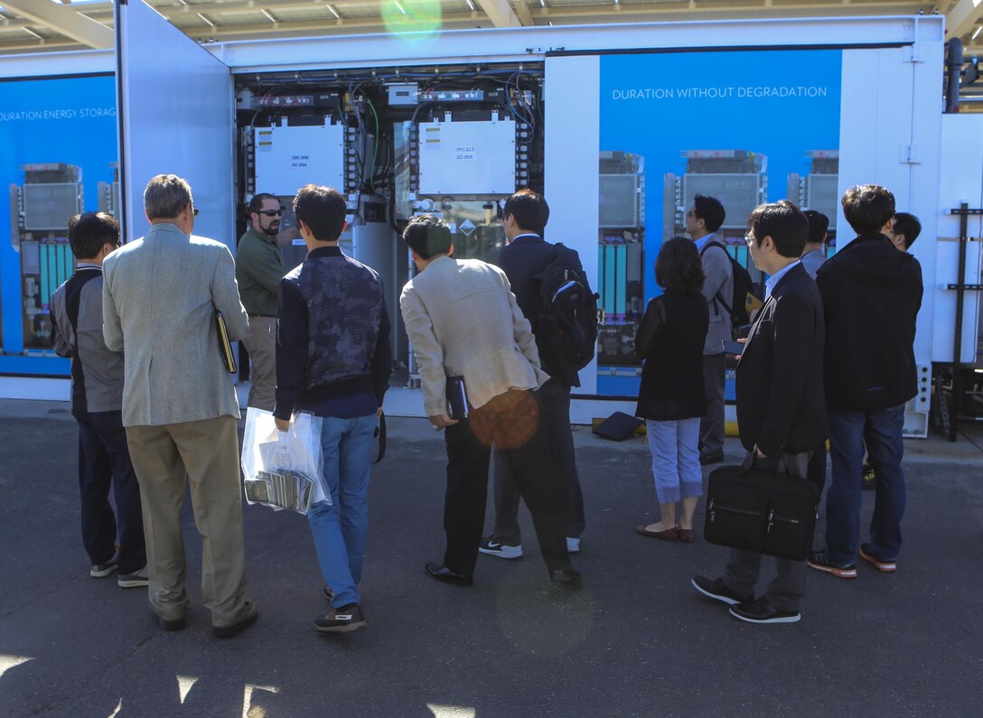 Mick Wasco, energy program manager for Marine Corps Air Station Miramar, Calif., shows a Korean delegation the Primus Power battery during their visit aboard MCAS Miramar, Feb. 17. A Primus Power battery is a liquid battery used to store energy on the electric grid aboard the installation. The delegation consisted of 14 South Korean citizens and two American citizens. (U.S. Marine Corps photo by Cpl. Kimberlyn Adams/Released)