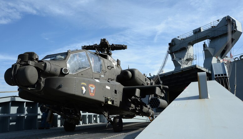 A Apache is being offloaded from the Cape Race, a vehicle carrier stationed in Norfolk, Virginia, during a four-day, joint redeployment operation aboard Marine Corps Support Facility, Blount Island Command, Jacksonville, Fla., Jan. 13-17. Soldiers with the 101st Combat Aviation Brigade, Fort Campbell, Ky., nicknamed the “Wings of Destiny,” returned to BICmd from their nine-month deployment to Afghanistan.