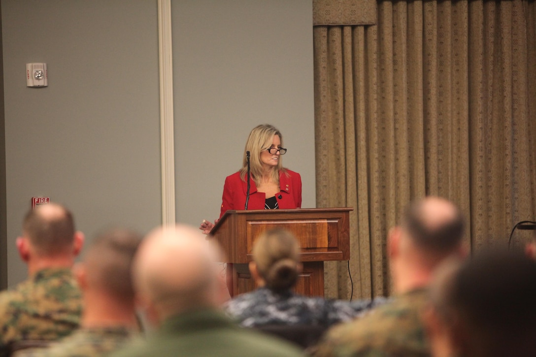 Kim Ruocco speaks with senior leaders during the Suicide Prevention Leadership Symposium at Marine Corps Air Station Cherry Point, N.C., Jan. 28. The Marines were visited by suicide prevention specialist who spoke on topics including: the difference between suicide prevention and post-vention; national trends and support for suicide; and Marine Corps initiatives and response to suicide. During the seminar senior leaders were able to ask questions and deliberate on ways to improve the Marine Corps approach to handle suicide. Ruocco is the chief external relations officer for suicide prevention and post-vention with the Tragedy Assistance Program for Survivors. 