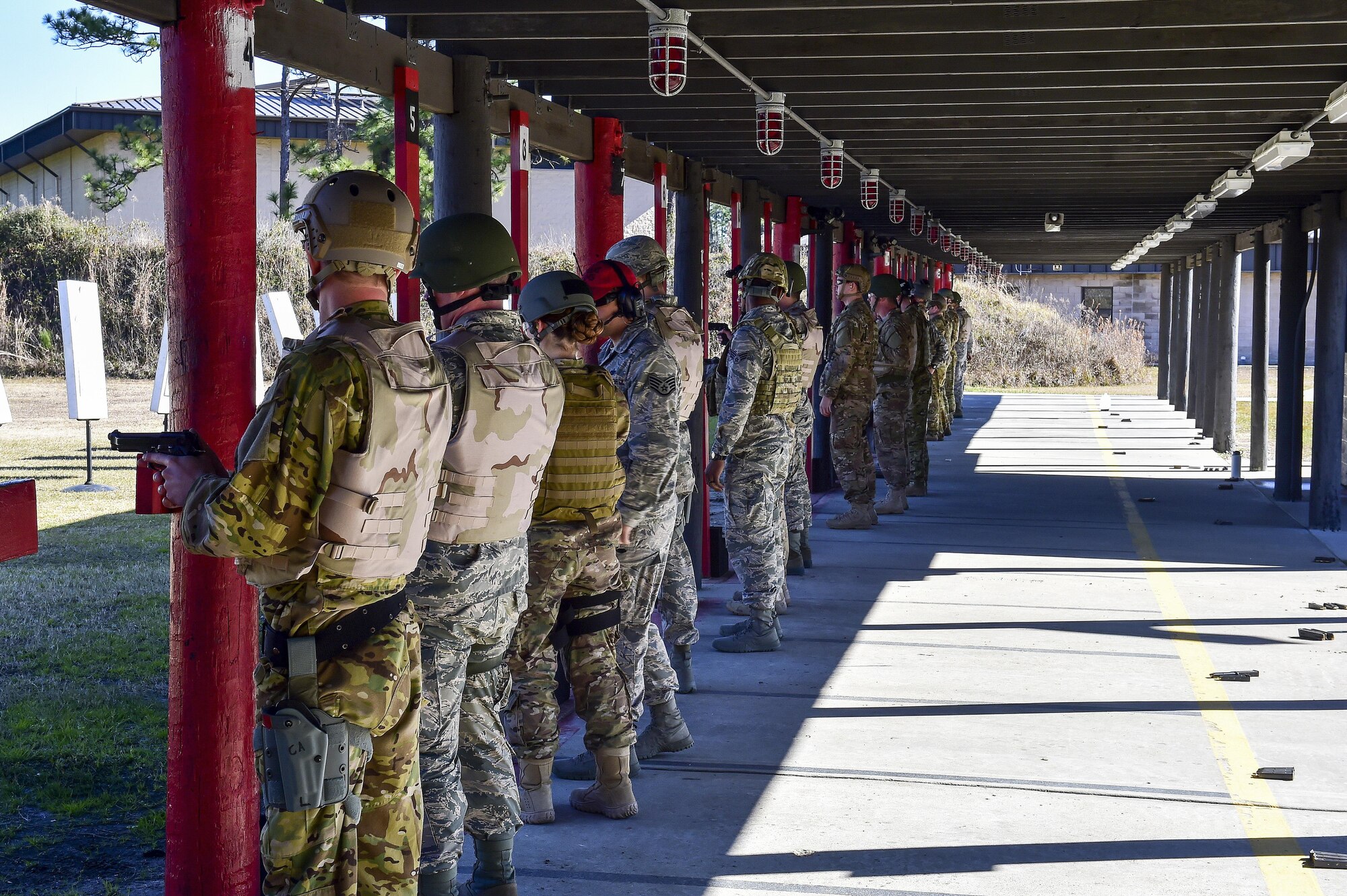 Air Commandos prepare to qualify on the M9 pistol at the combat arms training and maintenance range, Hurlburt Field, Fla., Feb 17, 2016. CATM instructors train and qualify Airmen on required weapons to be ready for future deployments. (U.S. Air Force photo by Senior Airman Jeff Parkinson)