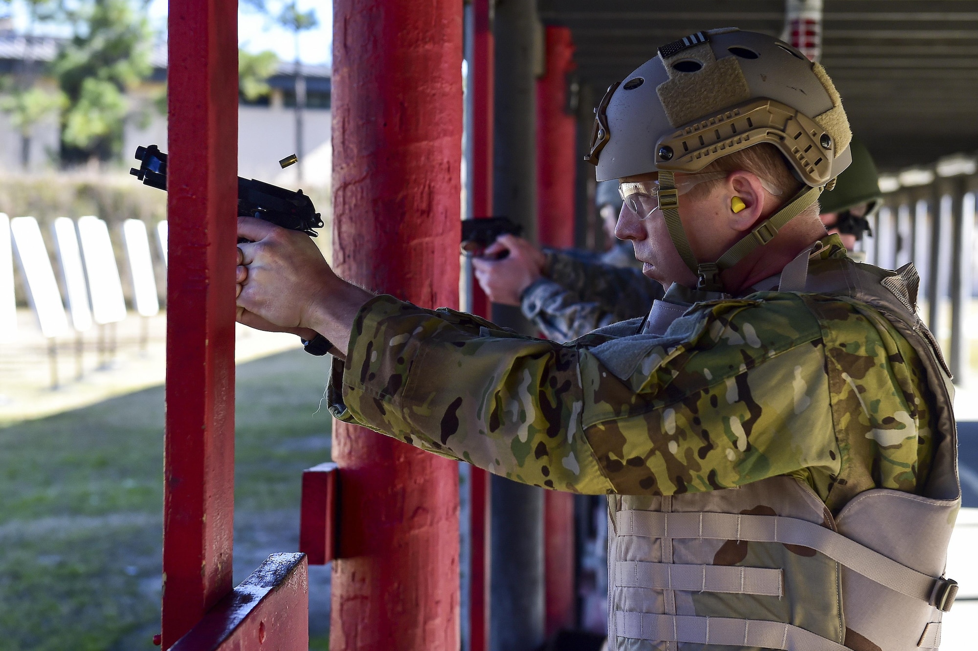 Capt. Robert Armour, a U-28A combat systems officer with the 34th Special Operations Squadron, fires an M9 pistol at the combat arms training and maintenance range, Hurlburt Field, Fla., Feb 17, 2016. Airmen are required to qualify on the M9 pistol and M4 rifle prior to being deployed. (U.S. Air Force photo by Senior Airman Jeff Parkinson)