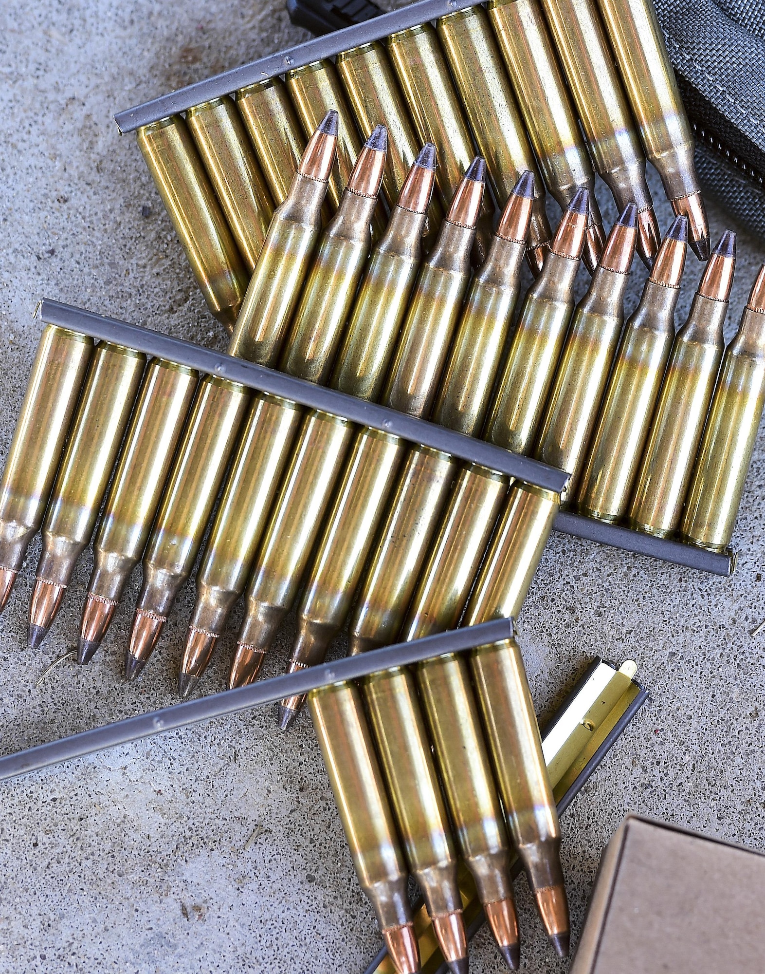 Ammunition for M4 rifles lies on the ground at the combat arms training and maintenance range, Hurlburt Field, Fla., Feb. 16, 2016. Airmen are provided ammunition in order to practice and qualify on the weapon needed for their deployment. (U.S. Air Force photo by Senior Airman Jeff Parkinson)