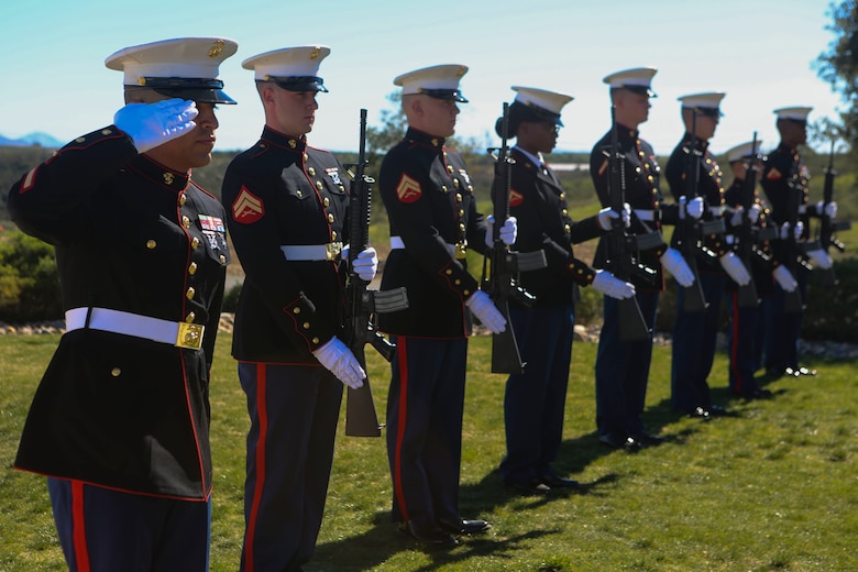 Marines stationed at Marine Corps Air Station Miramar salute during “Taps” at a funeral aboard Miramar National Cemetery, San Diego, Feb. 16. Funeral detail honors a military tradition for fallen active-duty members and veterans alike. The tradition includes the playing of “Taps,” the folding of an American flag to be presented to the next-of-kin of the deceased, and the 21-gun salute. (U.S. Marine Corps photo by Lance Cpl. Harley Robinson/Released)
