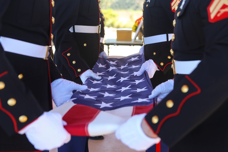 Marines stationed at Marine Corps Air Station Miramar prepare the American flag for presentation to the daughter of the deceased at a funeral aboard Miramar National Cemetery, San Diego, Feb. 16. Funeral detail honors a military tradition for fallen active-duty members and veterans alike. The tradition includes the playing of “Taps,” the folding of an American flag to be presented to the next-of-kin of the deceased, and the 21-gun salute. (U.S. Marine Corps photo by Lance Cpl. Harley Robinson/Released)