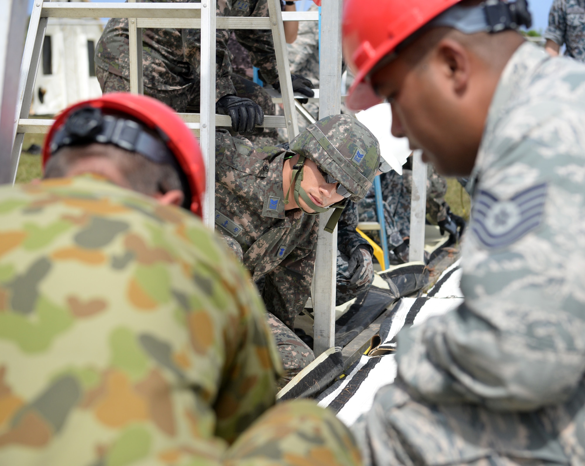 Republic of Korea Air Force Master Sgt. Yong Hwan Han, a barrier maintenance supervisor, secures contour ropes to a base frame for a small shelter system setup during Partner Nation Silver Flag, Feb. 13, 2016, at Andersen Air Force Base, Guam. The exercise is a small part of the first multilateral Silver Flag Exercise, a U.S. Pacific Command multilateral Theater Security Cooperation Program subject matter expert exchange event designed to build partnerships and promote interoperability through the equitable exchange of civil engineer related information. (U.S. Air Force photo by Senior Airman Joshua Smoot/Released)