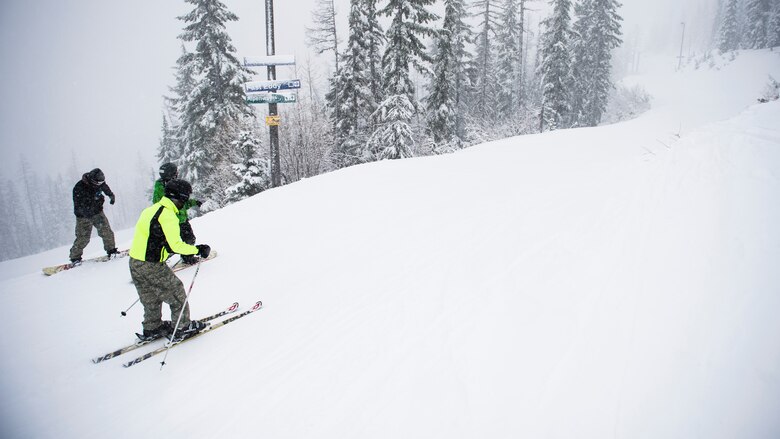 Airmen from Fairchild Air Force Base ski and board down a trail Feb. 13, 2016, Silver Mountain Resort, Idaho. A long list of different programs are offered at Outdoor Rec. Some include indoor and outdoor rock climbing, cycling, scuba diving, sky diving, skiing and rafting. (U.S. Air Force photo/Airman 1st Class Sean Campbell)