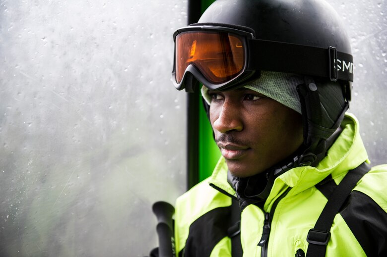 Senior Airman Adeola Adeboyejo, 92nd Force Support Squadron career development technician, rides a gondola to the peak of Silver Mountain Resort, Feb. 13, 2016, Silver Mountain Resort, Idaho. The total coast for each Airman that partook in the skiing trip was 10 dollars. Included in that ten dollars was everything needed, transportation to and from the mountain, a lift ticket and rental equipment. (U.S. Air Force photo/Airman 1st Class Sean Campbell)