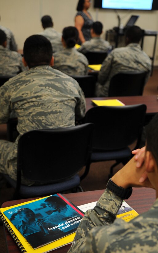 Dyess Airmen participate in a personal financial readiness class Feb. 11, 2016, at the Airmen and Family Readiness Center at Dyess Air Force Base, Texas. The A&FRC offers more than 15 classes to help educate Airmen on financial management. Topics include Back-to-Basics Budgeting, Money and Marriage, Financial Planning, Car Buying and many more. (U.S. Air Force photo by Senior Airman Shannon Hall/Released)