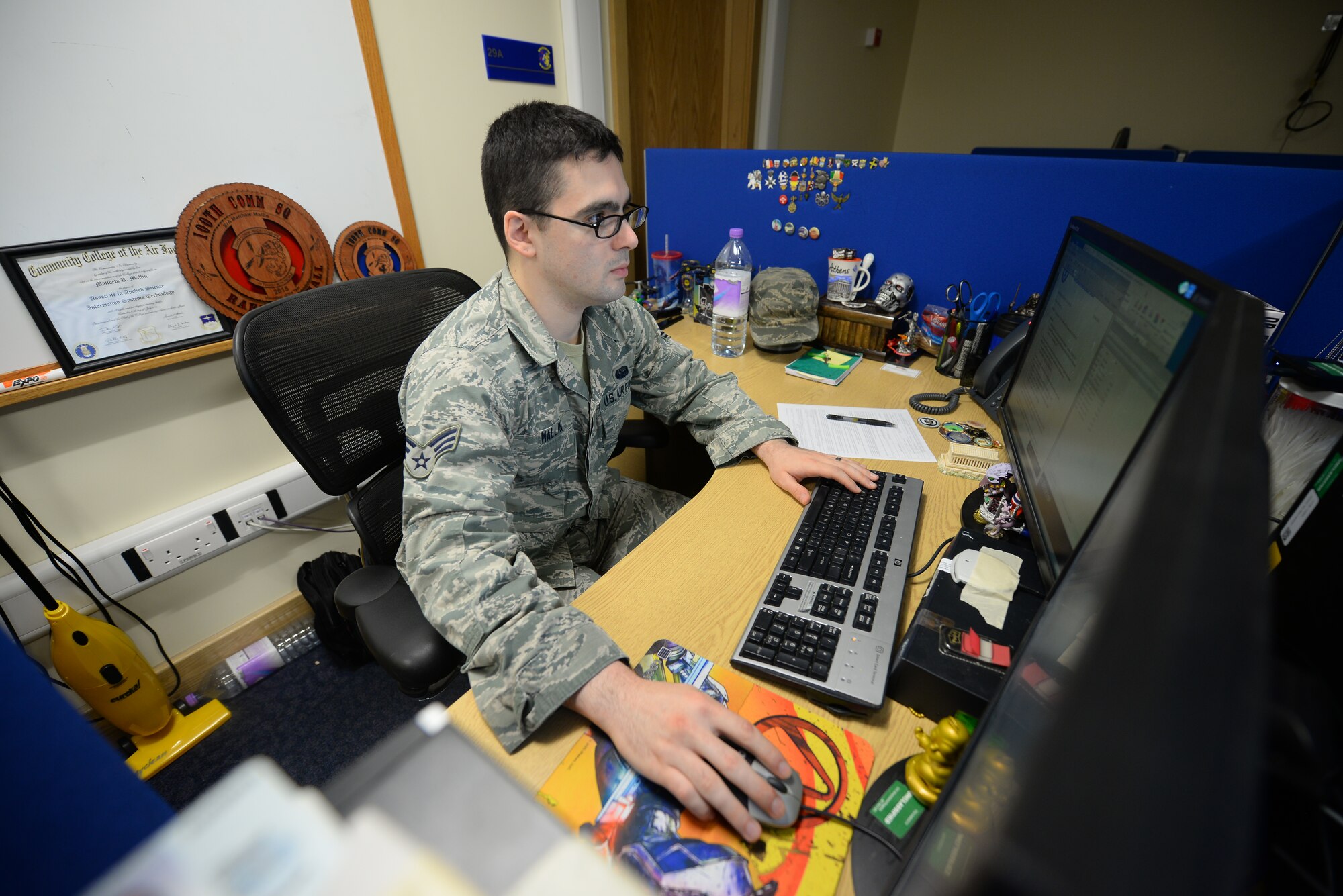 U.S. Air Force Senior Airman Matthew Mallin, 100th Communication Squadron wing cyber security technician, works on his computer Feb. 11, 2016 on RAF Mildenhall, England. Mallin and his wife Sasha Southee-Mallin, 48th Medical Support Squadron laboratory technician, provided lifesaving medical care until emergency responders arrived to a heart-attack victim Jan. 17, 2016, while on vacation in Norway. (U.S. Air Force photo by Staff Sgt. Micaiah Anthony/Released)