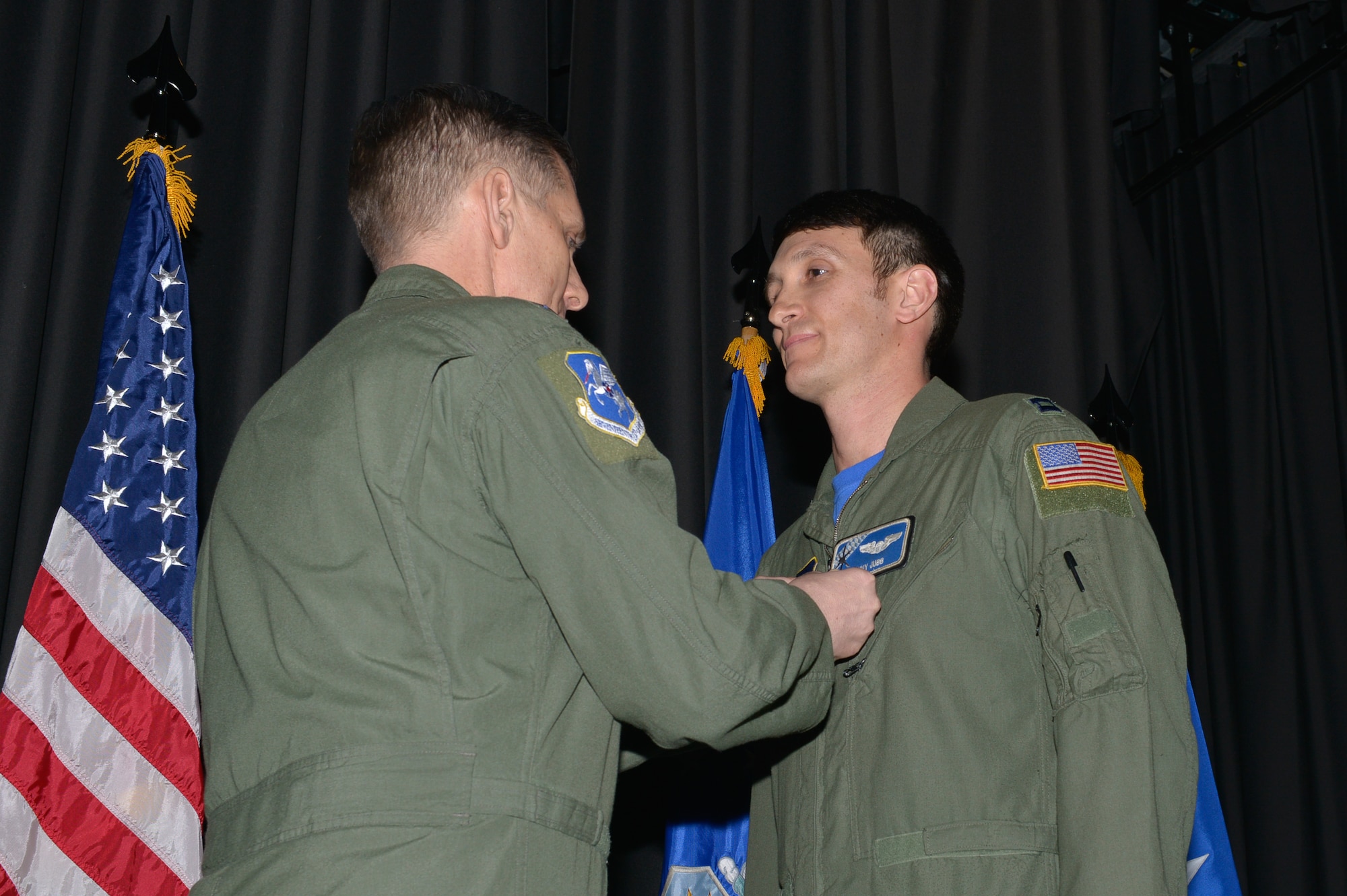 Capt. Kenneth Jubb, 37th Airlift Squadron flight commander, gets The Air Medal pinned on by Lt. Gen. Timothy Ray, 3rd Air force and 17th Expeditionary Air Force commander, Feb. 19, 2016, at Ramstein Air Base, Germany. Jubb received the prestigious award for demonstrating exemplary airmanship and professionalism to safely recover an Aircraft during an emergency ramp-open landing. (U.S. Air Force/Airman 1st Class Lane T. Plummer)