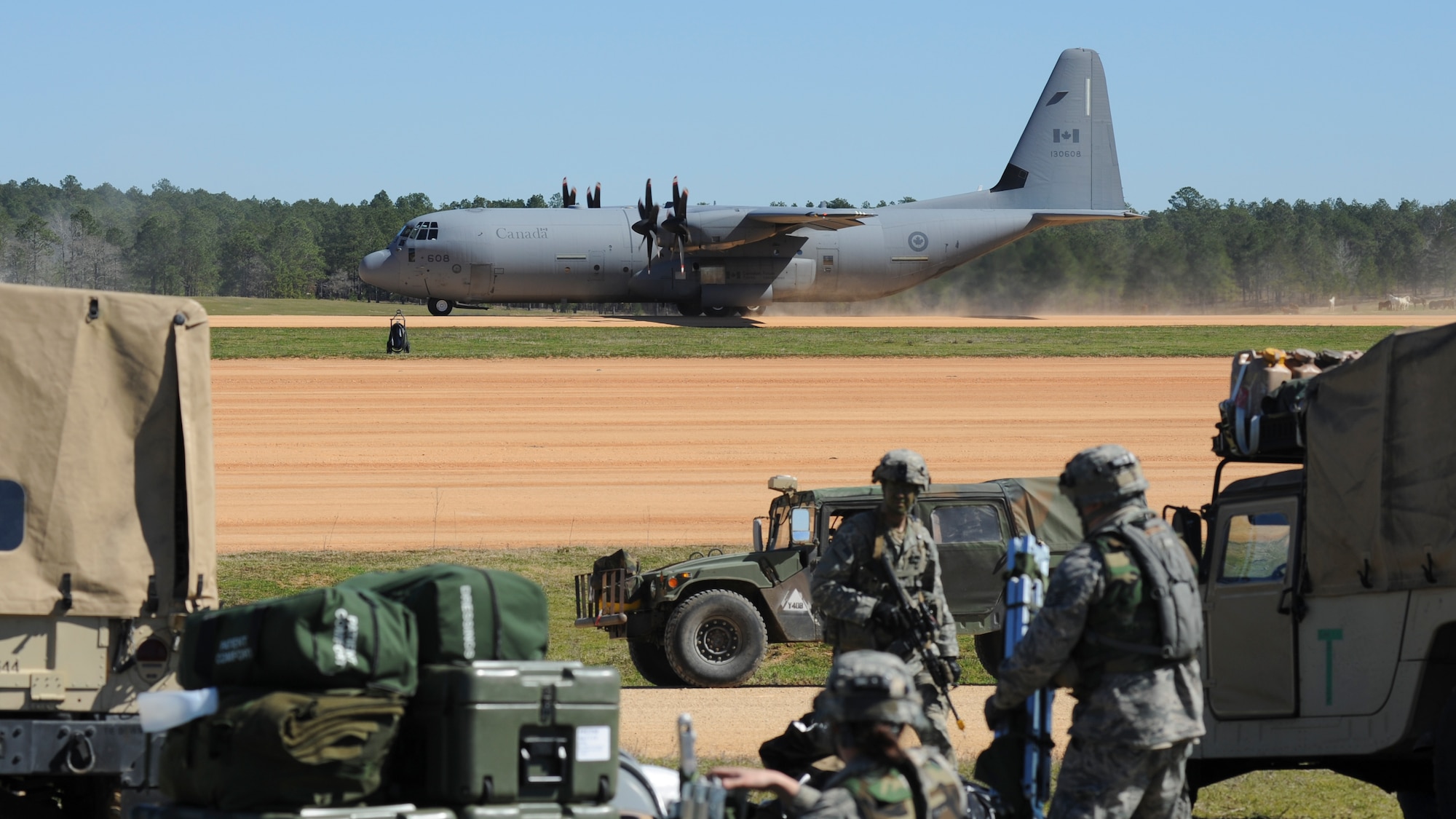 A Royal Canadian Air Force C-130J lands at the Geronimo Landing Zone during GREEN FLAG 16-04 on Fort Polk, La., Feb. 17, 2016. U.S. forces routinely work with NATO partners during Green Flag exercises at the Joint Readiness Training Center. (U.S. Air Force photo/Senior Airman Harry Brexel)