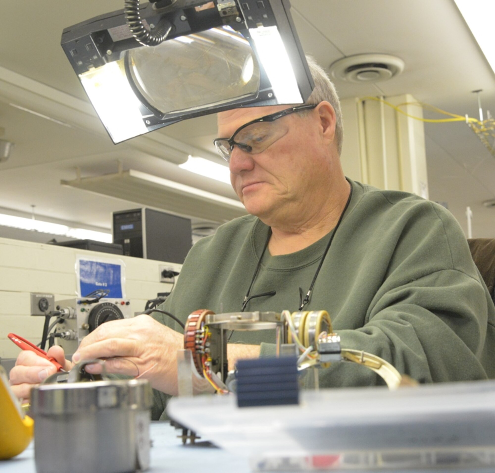 Michael Quinn, 566th Electronics Maintenance Squadron mechanic, repairs a C-12 directional gyroscope for the C-130. The squadron is responsible for many of the Air Force’s aviation electronics repairs on the C-130, C-17, F-15, A-10 and other weapons systems. (U.S. Air Force photo by Ray Crayton)
