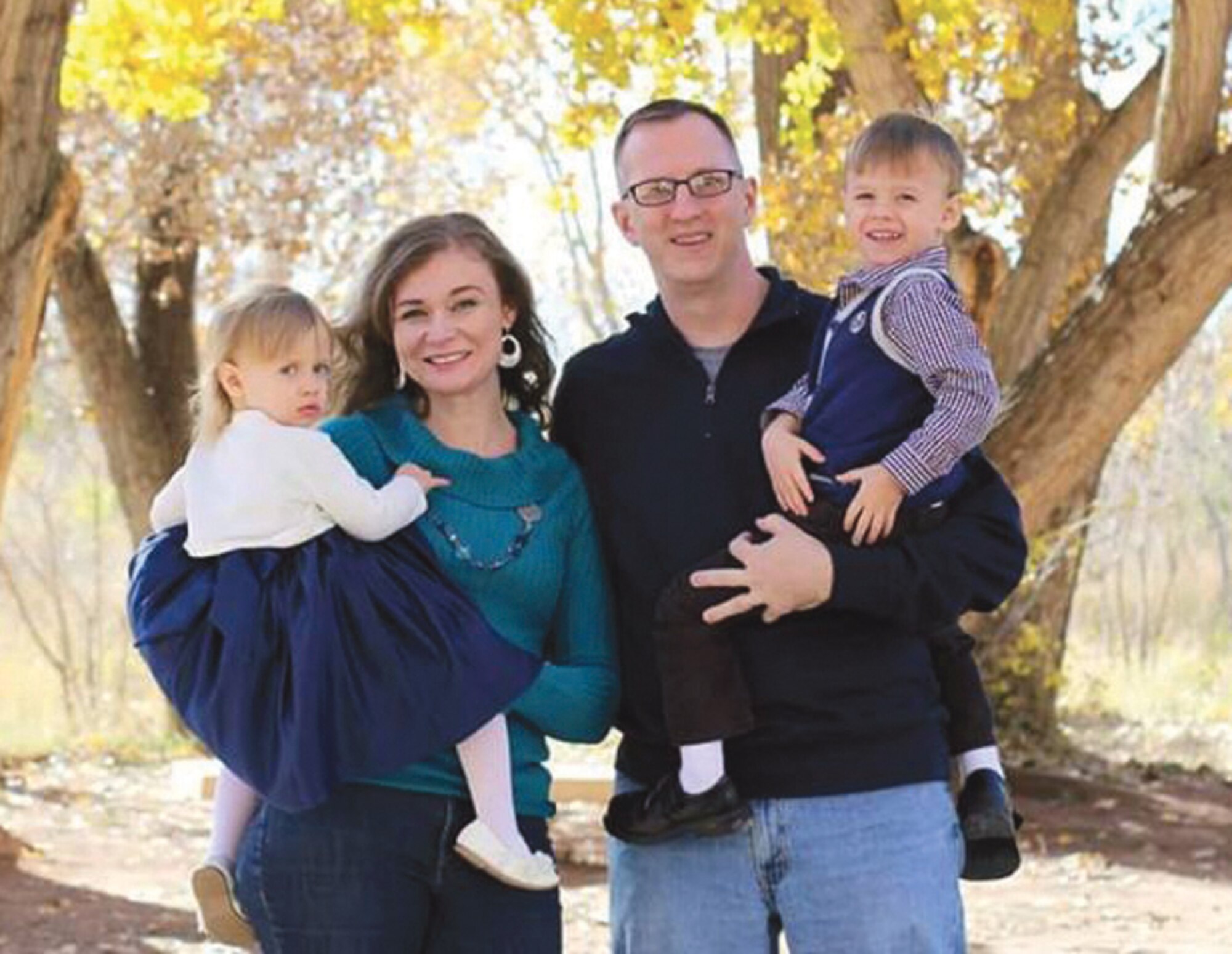 Dinah Dziolek, second from left, poses with her family, 1-year-old daughter Iliana, husband David and 3-year-old son Isaiah. Dinah was selected as Kirtland Military Spouse of the Year through a program sponsored by Military Spouse Magazine. (Courtesy photo)