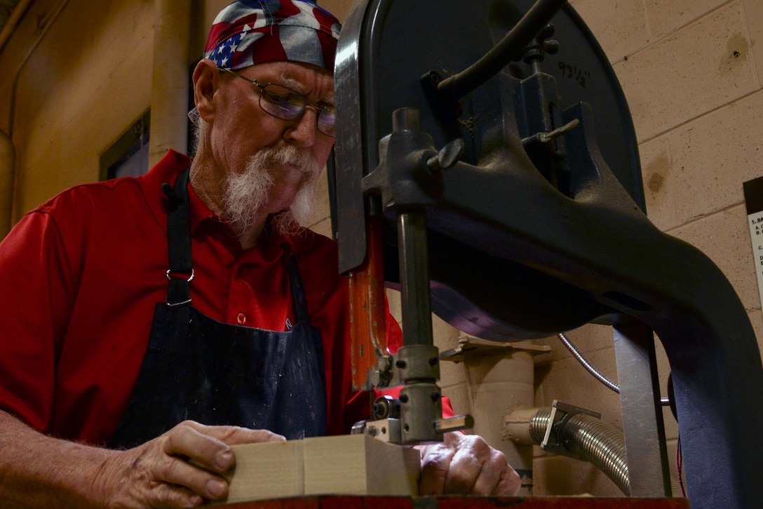 John Fischbach Sr., 23d Force Support Squadron recreation aide, saws a piece of wood, Jan. 15, 2016, at Moody Air Force Base, Ga. Fischbach has worked at Moody’s woodshop for more than 10 years. (U.S. Air Force photo by Airman 1st Class Janiqua P. Robinson/Released)