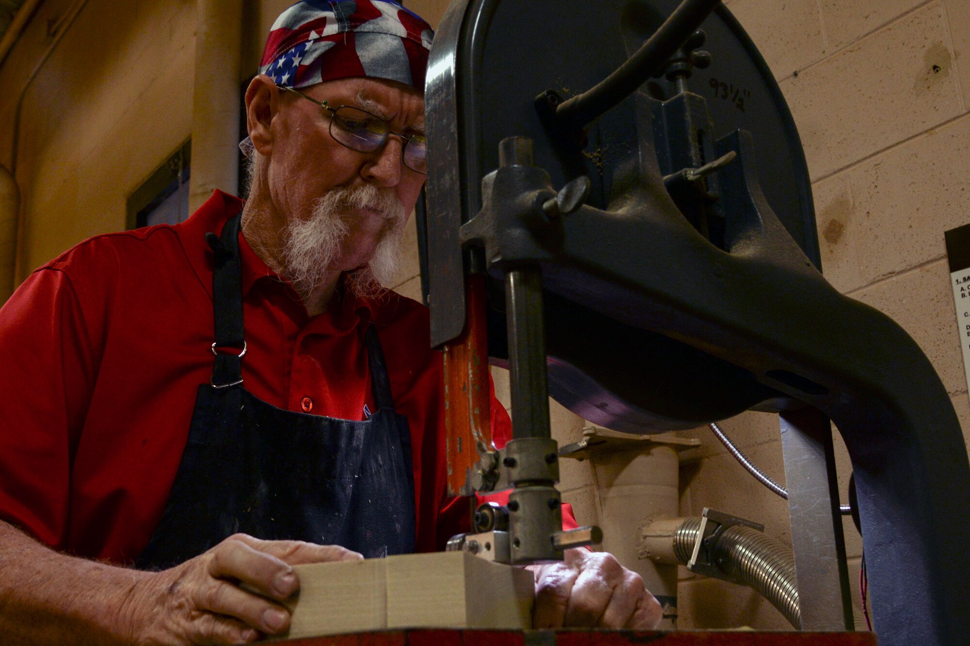 John Fischbach Sr., 23d Force Support Squadron recreation aide, saws a piece of wood, Jan. 15, 2016, at Moody Air Force Base, Ga. Fischbach has worked at Moody’s woodshop for more than 10 years. (U.S. Air Force photo by Airman 1st Class Janiqua P. Robinson/Released)