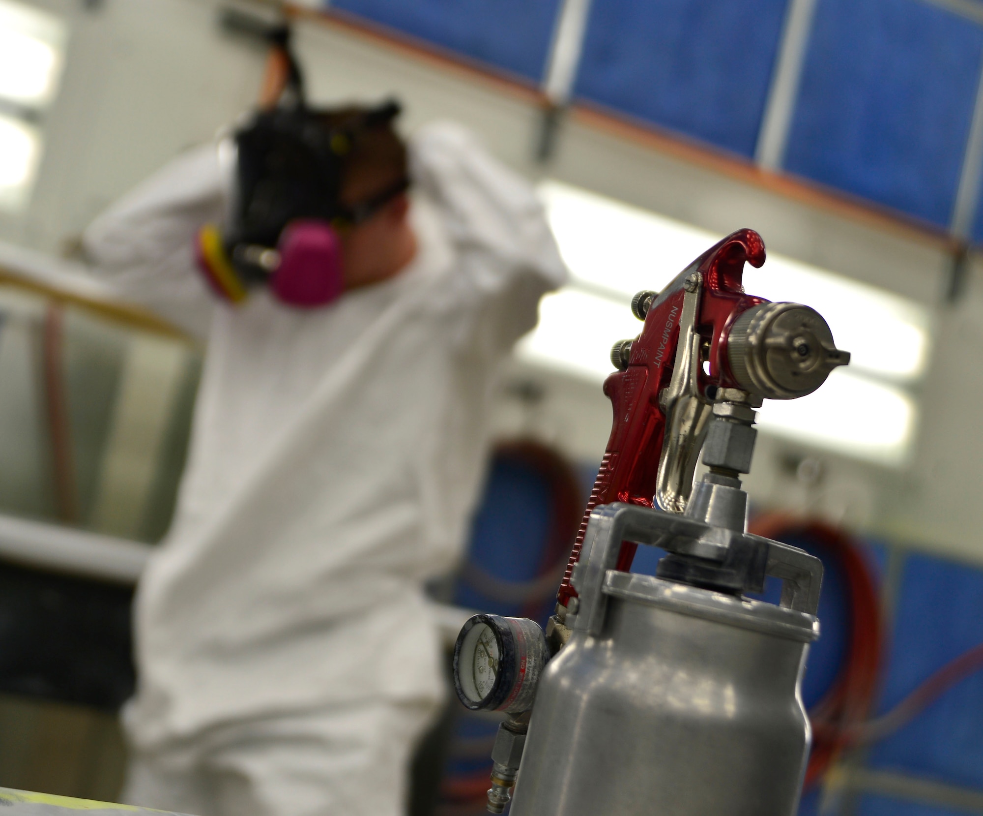 Senior Airman Joshua, 432nd Maintenance Squadron aircraft structural maintenance journeyman dons a mask designed to keep hazardous paint and composite particles from being breathed in before sanding a panel for the MQ-1 Predator Feb. 18, 2016, at Creech Air Force Base, Nevada. Without the aircraft structural maintenance shop, there would be no means of organizational or field level repair for the MQ-1 Predator and MQ-9 Reaper remotely piloted aircraft. If the aircraft develops a structural flaw caused by wear and tear, moisture absorption or any way of structurally damaging the aircraft, it would eventually, dependent on the damage, become structurally unsound and not airworthy. (U.S. Air Force photo by Senior Airman Christian Clausen/Released)
