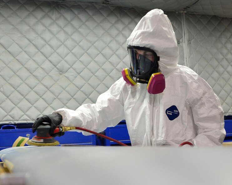 Senior Airman Joshua, 432nd Maintenance Squadron aircraft structural maintenance journeyman dons a mask before sanding a panel for the MQ-1 Predator Feb. 18, 2016, at Creech Air Force Base, Nevada. The aircraft structural maintainers shop maintains an excellent quality assurance rate of 95 percent. The Air Force average is 80 percent.  (U.S. Air Force photo by Senior Airman Christian Clausen/Released)