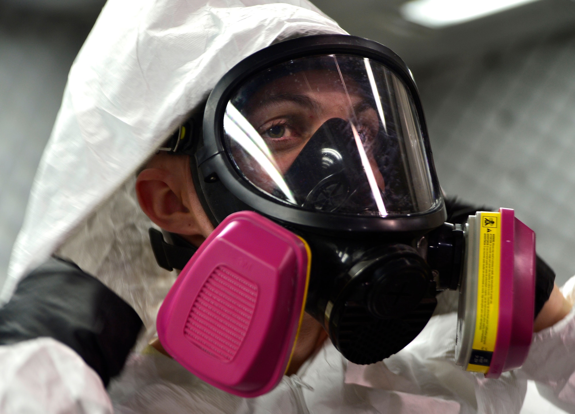 Senior Airman Joshua, 432nd Maintenance Squadron aircraft structural maintenance journeyman dons a mask designed to keep hazardous paint and composite particles from being breathed in before sanding a panel for the MQ-1 Predator Feb. 18, 2016, at Creech Air Force Base, Nevada. The aircraft structural maintenance shop is responsible for the repair and fabrication of aircraft skin, structures, metallic tube assemblies, windows, canopies and corrosion control for the MQ-1 Predator and MQ-9 Reaper. (U.S. Air Force photo by Senior Airman Christian Clausen/Released)