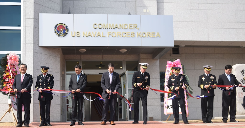 Rear. Adm. Bill Byrne, commander U.S. Naval Forces Korea, Gen. Curtis Scaparrotti,  commander, U.S. Forces Korea, Vice Adm. Ki-sik Lee, commander Republic of Korea Fleet, Maj. Gen. James Walton, director of transformation and re-stationing for U.S. Forces Korea, Hon. Mark Lippert, U.S. ambassador to the Republic of Korea, Jung Gyung-jin, mayor of Busan for administrative affairs, and Lee Jong-cheol, Nam-gu district mayor, cut the ribbon of CNFK's new head quarters building during a ribbon-cutting ceremony. This ceremony marks the opening of CNFK’s new headquarters building in Busan since their relocation from Seoul as part of the greater Yongsan Relocation Plan.