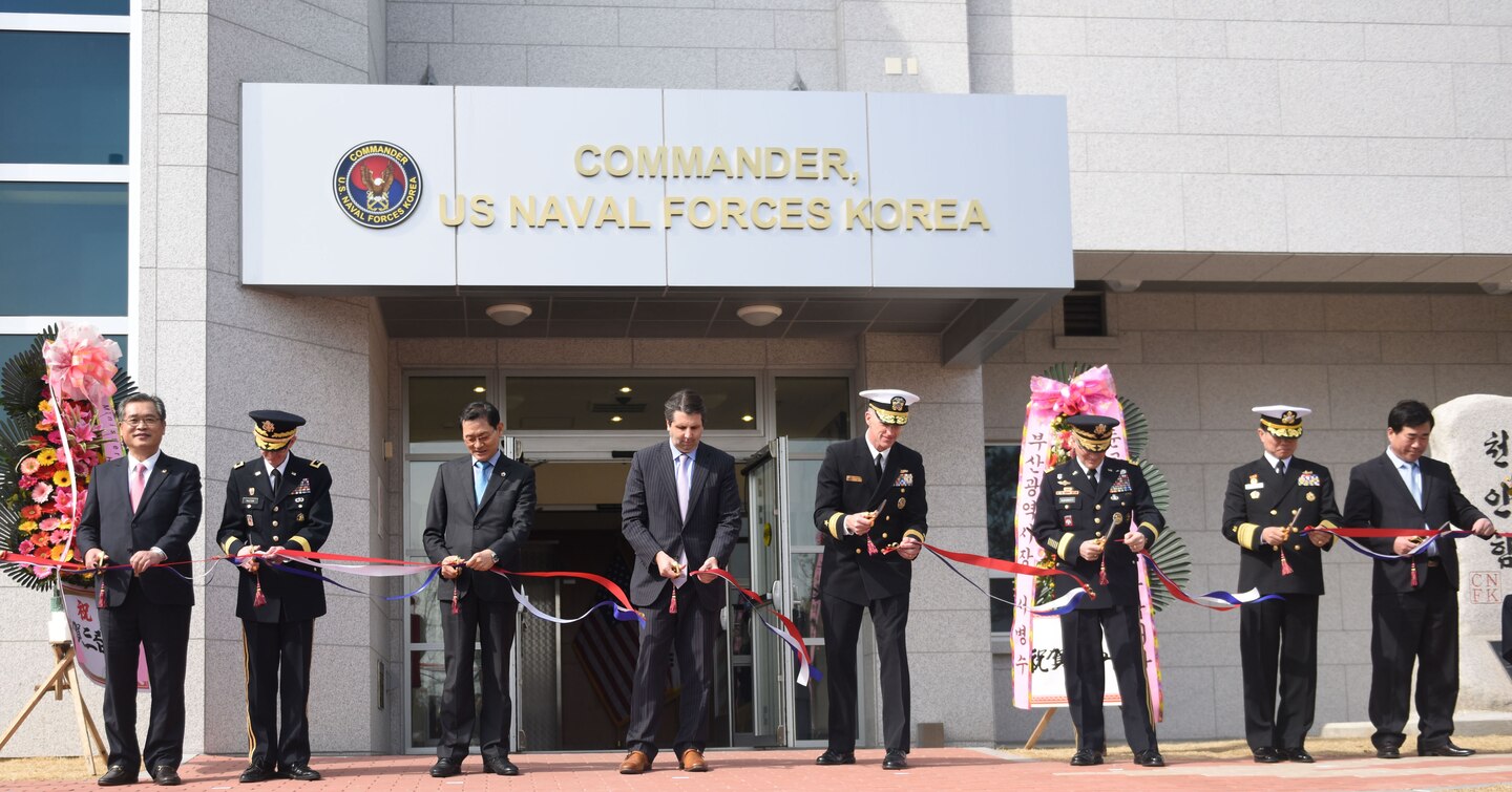 Rear. Adm. Bill Byrne, commander U.S. Naval Forces Korea, Gen. Curtis Scaparrotti,  commander, U.S. Forces Korea, Vice Adm. Ki-sik Lee, commander Republic of Korea Fleet, Maj. Gen. James Walton, director of transformation and re-stationing for U.S. Forces Korea, Hon. Mark Lippert, U.S. ambassador to the Republic of Korea, Jung Gyung-jin, mayor of Busan for administrative affairs, and Lee Jong-cheol, Nam-gu district mayor, cut the ribbon of CNFK's new head quarters building during a ribbon-cutting ceremony. This ceremony marks the opening of CNFK’s new headquarters building in Busan since their relocation from Seoul as part of the greater Yongsan Relocation Plan.