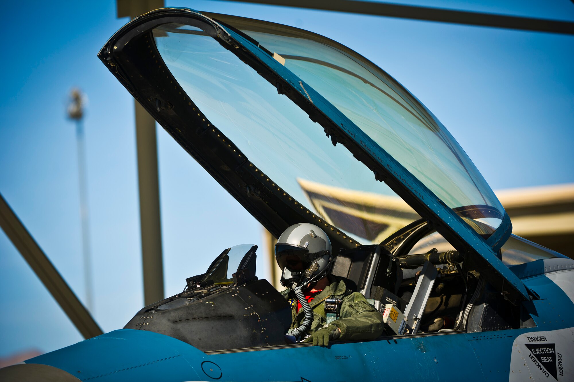 Lt. Col. Joshua Spear, 926th Operations Group F-16 Fighting Falcon pilot, conducts pre-flight checks before a training mission during Red Flag 16-1 on Feb. 5, 2016, at Nellis Air Force Base, Nev. Red Flag is a realistic combat exercise involving United States and allied air forces conducing training operations on the 15,000 square mile Nevada Test and Training Range. (U.S. Air Force photo/Senior Airman Brett Clashman)