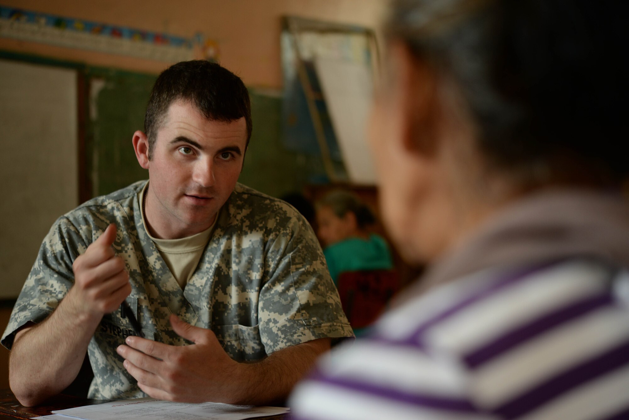 U.S. Army 1st. Lt. Clinton Stephens, Joint Task Force-Bravo Medical Element nurse, screens a local woman during a Medical Readiness Training Exercise in the Cortes Department, Honduras, Feb. 18, 2016. The screening process is a very crucial step in diagnosing patients to help them with further treatment and prescription medication.  (U.S. Air Force Photo by Staff Sgt. Westin Warburton/Released)