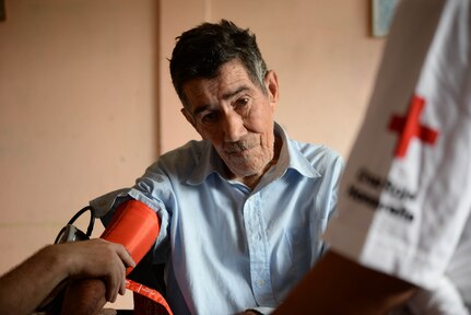 A local man gets his blood pressure checked during a Medical Readiness Training Exercise in the Cortes Department, Honduras, Feb. 18, 2016. These exercises provide military members with essential training and allow the members of Joint Task Force-Bravo Medical Element to practice real world skills in austere locations while developing relationships with host nation partners.  (U.S. Air Force Photo by Staff Sgt. Westin Warburton/Released)