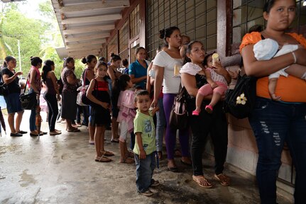 Hondurans wait to see screening nurses during a medical readiness training exercise in the Cortes Department, Honduras, Feb. 18, 2016. During the screening phase, patients are checked by U.S. Army nurses to determine what treatment or medication is needed.  (U.S. Air Force Photo by Staff Sgt. Westin Warburton/Released)