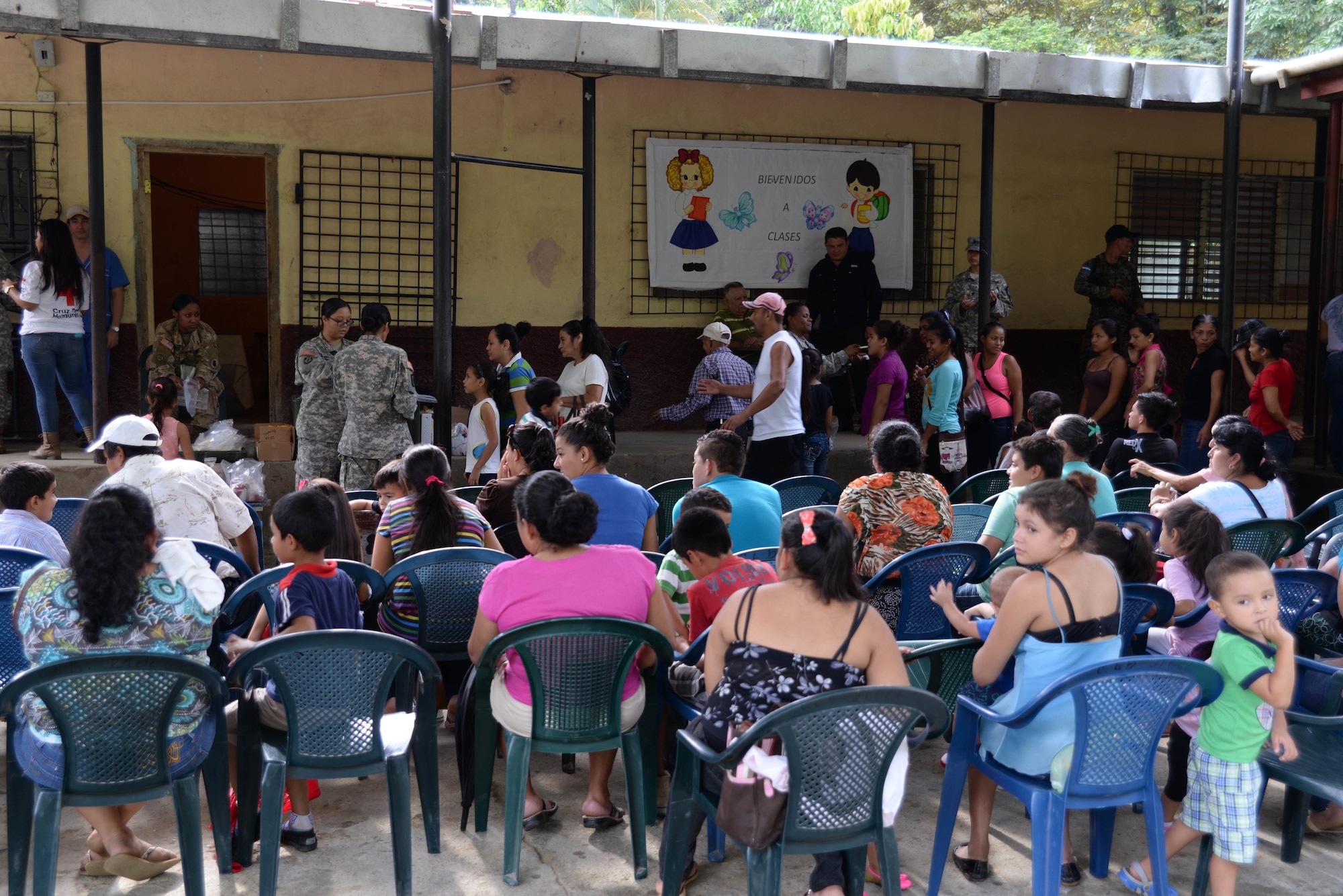 Hondurans listen to a preventative medicine briefing during a medical readiness training exercise in the Cortes Department, Honduras, Feb. 18, 2016. MEDRETES like this provide locals with basic medical treatments along with prescription medicine and dental services and build relashionships between locals and U.S. military forces within the host country.  (U.S. Air Force Photo by Staff Sgt. Westin Warburton/Released)