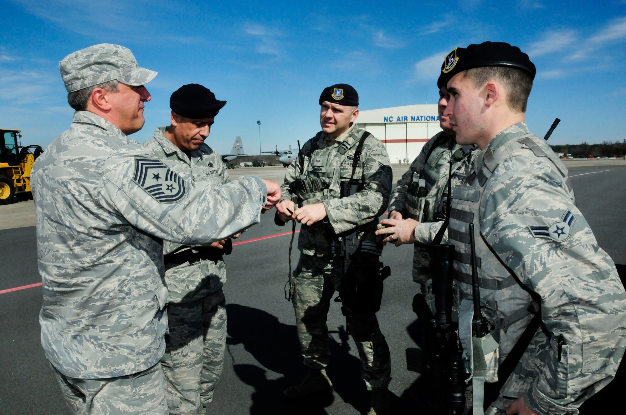 U.S. Air Force Command Chief Master Sgt. Salvatore “Sal” Pecorella, talks with members of the 145th Security Forces Squadron during February’s Unit Training Assembly at the North Carolina Air National Guard Base, Charlotte Douglas International Airport, Feb. 6, 2016. Pecorella, who was recently selected as the new command chief for the 145th Airlift Wing, stays in touch by keeping the lines of communication open. Pecorella began his military career when he enlisted in the Air Force in May 1983, now he continues his career by carrying out his duties as a traditional guardsman in the highest enlisted position. (U.S. Air National Guard photo by Master Sgt. Patricia F. Moran/Released) 