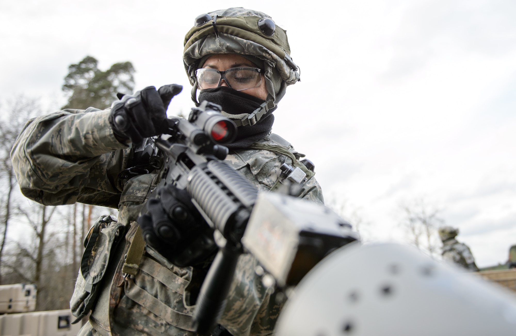 Staff Sgt. Yvonne Solorio, 1st Combat Communications Squadron client system technician, clears her weapon after a mock fire fight Feb. 12, 2016, at Ramstein Air Base, Germany. The Airmen worked in shifts to guard and provide a quick response force to ensure the operations at their training base continued uninterrupted. (U.S. Air Force photo/Staff Sgt. Armando A. Schwier-Morales)