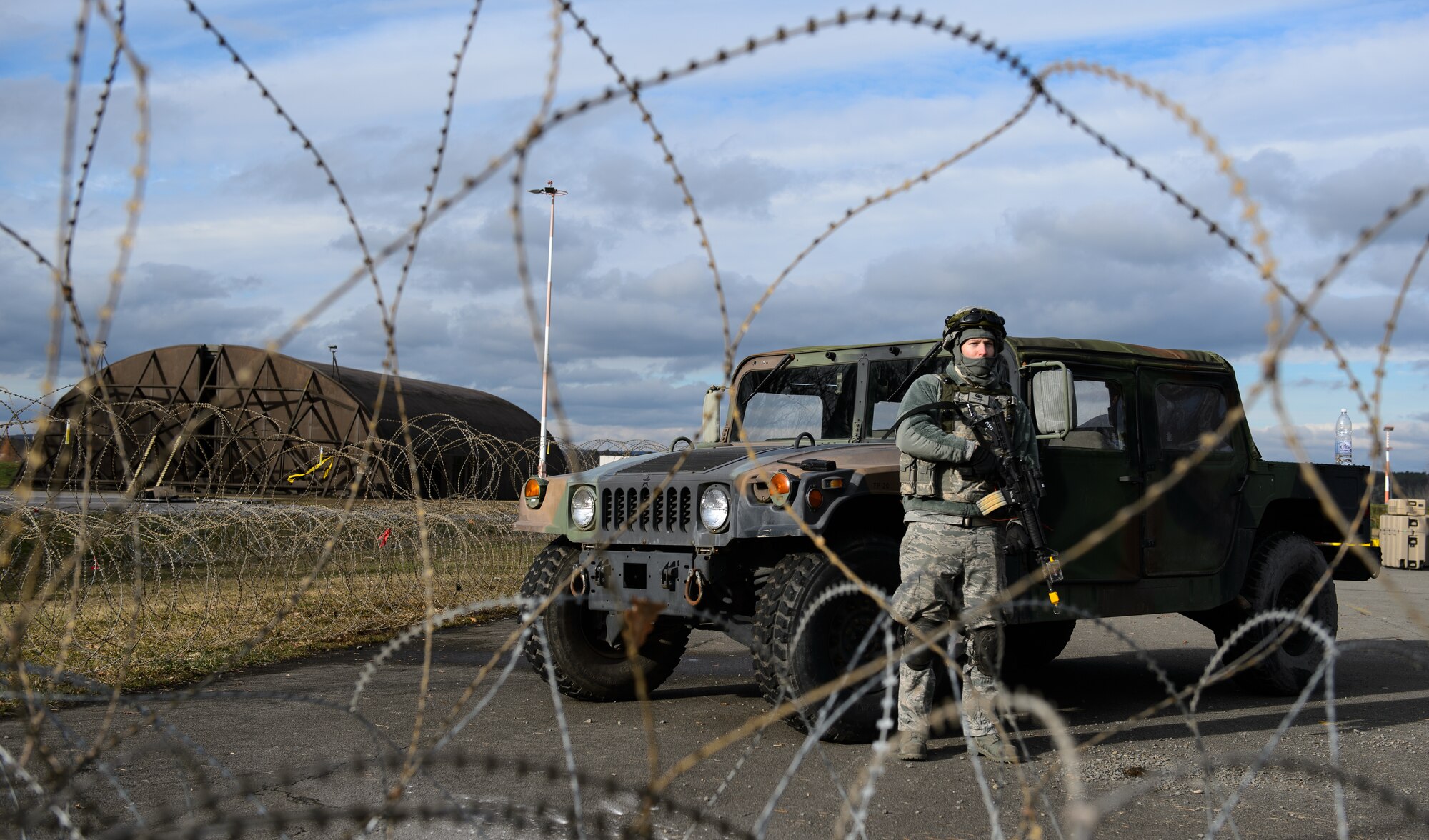 Senior Airman Daniel Cornwell, 1st Combat Communications Squadron tactical network operations technician, guards a sector at a mock base on Ramstein Air Base, Germany Feb. 12, 2016. Airmen from the 1st CBCS must be ready to deploy and defend the multi-millions of dollars’ worth of equipment they use to ensure information flow. (U.S. Air Force photo/Staff Sgt. Armando A. Schwier-Morales)