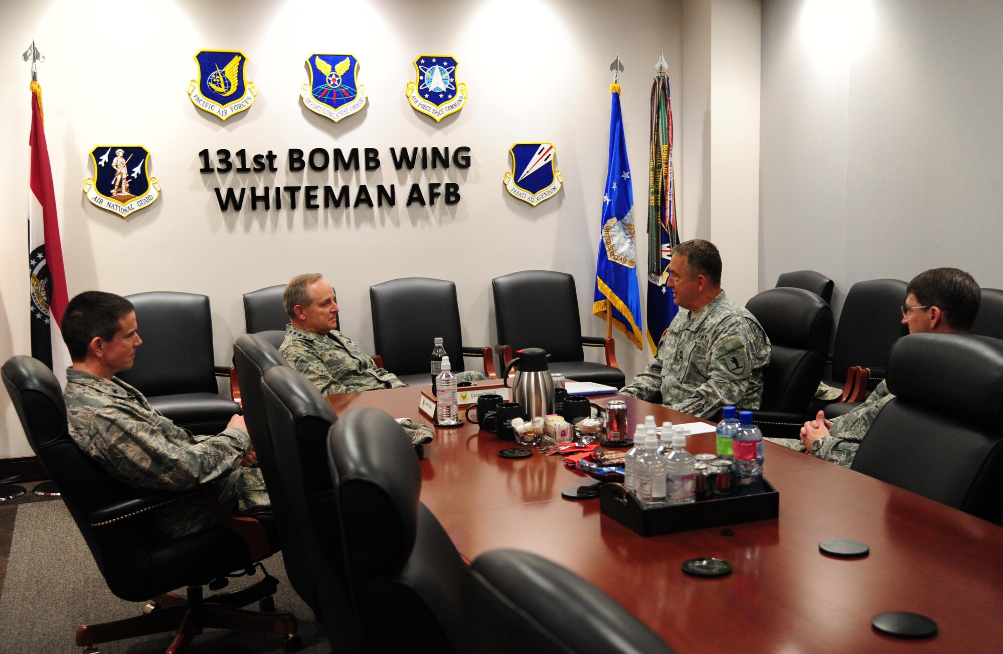 Air Force Chief of Staff Gen. Mark A. Welsh III, left center, speaks to Maj. Gen. Steve Danner, adjutant general of the Missouri National Guard, right center, during a visit at Whiteman Air Force Base, Mo., Feb. 17, 2016. Welsh met with Danner and base leadership to speak about the evolution of Total Force Integration and modernizing for the future. (U.S. Air Force photo by Senior Airman Joel Pfiester)