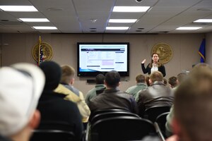 Kimberly Clemons, Joint Base Andrews Education and Training Center briefer, gives a higher education briefing to service members at JBA, Md., Feb. 18, 2016. The Education Center offers multiple courses, educational resources and college curriculum testing for service members seeking to earn college accreditation. (U.S. Air Force photo/Senior Airman Joshua R. M. Dewberry/RELEASED)