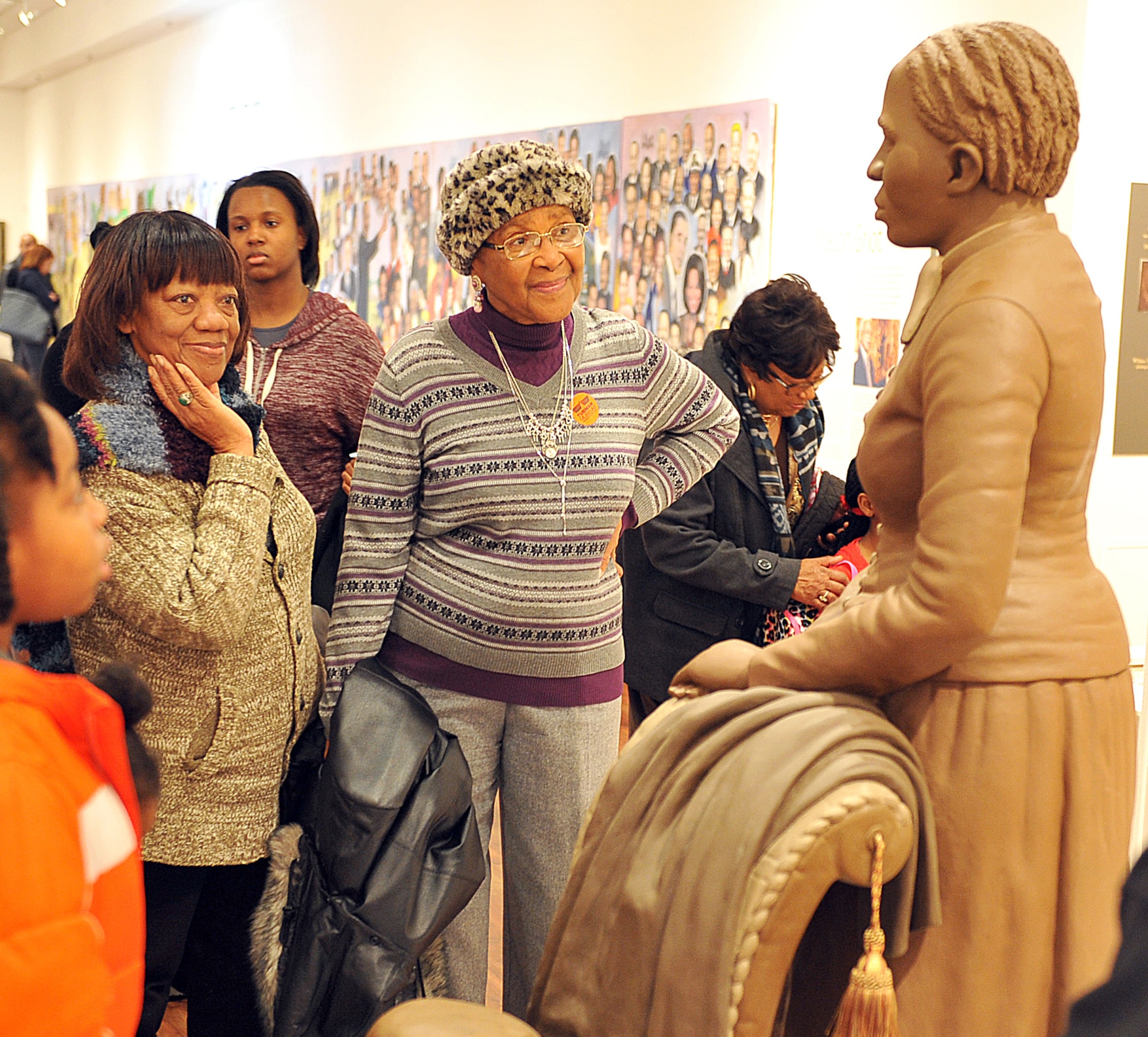 Nevelin Wright (left) and Lettie Johnson admire an exhibit in one of the Tubman Museum’s spacious art galleries.(U.S. Air Force photo by Tommie Horton) 
