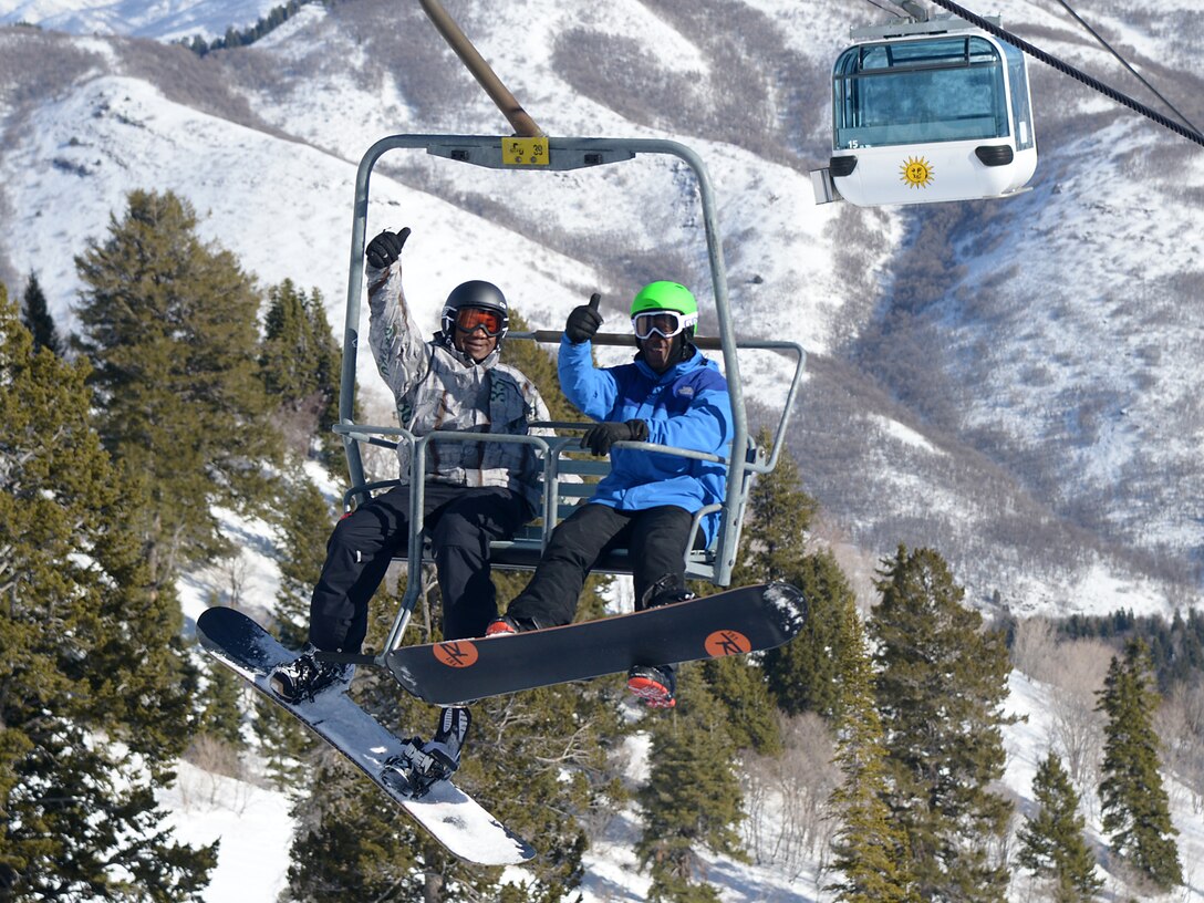 (Left to right) Lt. Col. Steven Oliver, 388th Component Maintenance Squadron commander and, Col. Ron Jolly, 75th Air Base Wing commander catch a lift to the top of the hill during Team Hill Ski Day Feb. 12. Military and civilian Airmen from Hill Air Force Base took advantage of one of the perks of being stationed in Utah when they took to the slopes at Snowbasin Resort for the annual event. (Air Force photo by Alex R. Lloyd) 