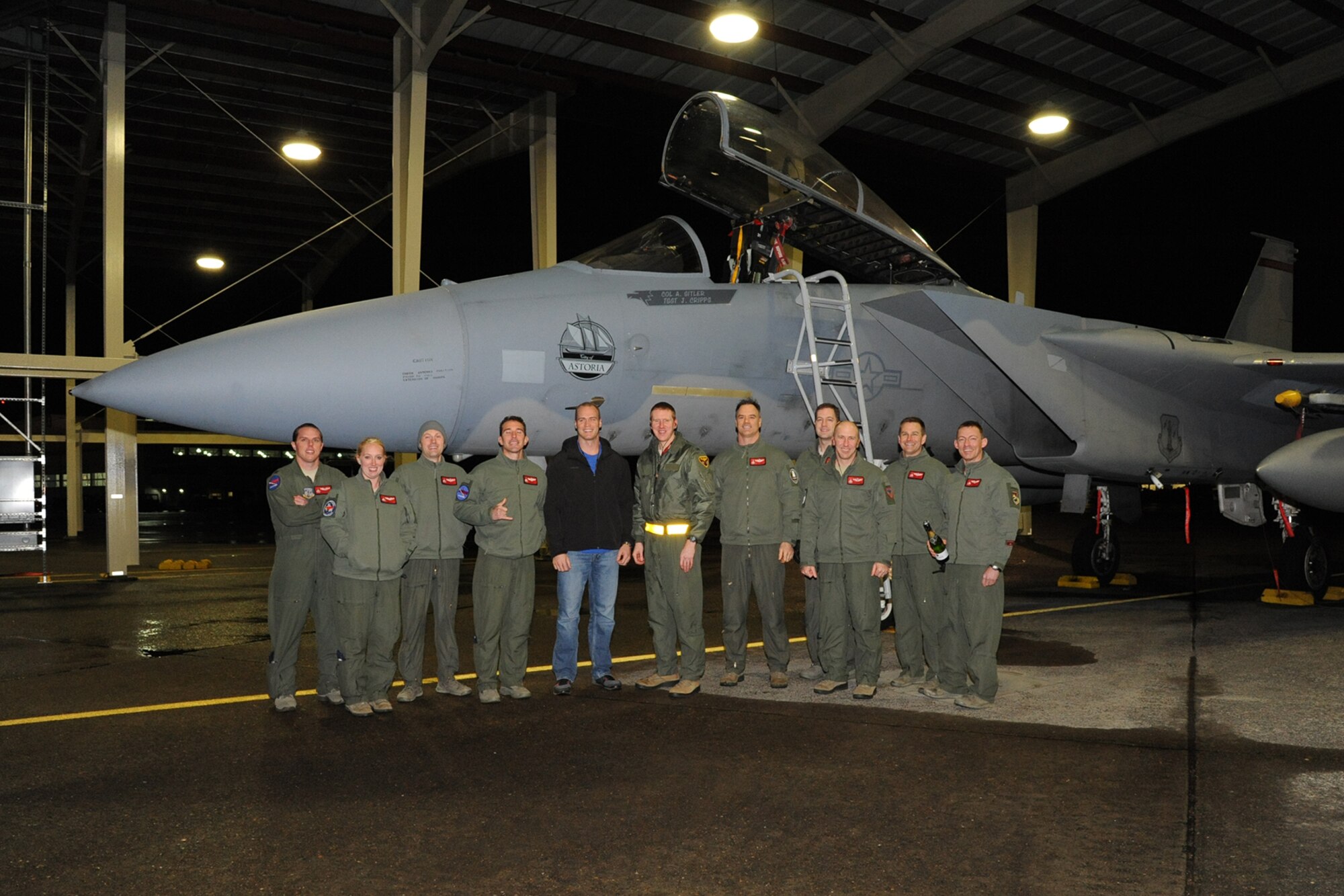 Col. Adam Sitler, 142nd Operations Group Commander, poses for a photo with the pilots of the 123rd Fighter Squadron upon returning from his flight marking 3,000 hours in the F-15 Eagle.  (U.S. Air National Guard photo by Master Sgt. Shelly Davison, 142nd Fighter Wing Public Affairs)