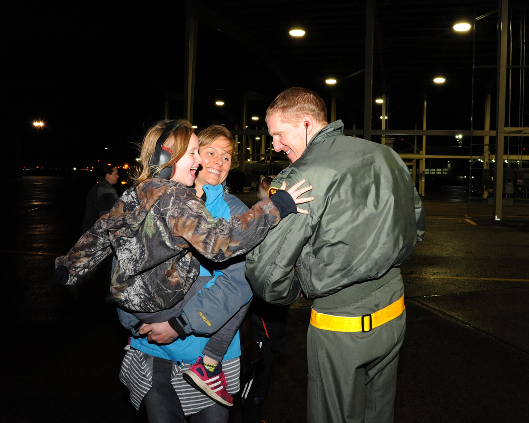 Col. Adam Sitler, 142nd Operations Group Commander, tacks on his 3,000 flight hour patch with the help of his daughter upon returning to the Portland Air National Guard Base, Ore., February 18, 2016.  He is the 99th pilot on record with Boeing as having achieved 3,000 flight hours in an F-15 Eagle.  (U.S. Air National Guard photo by Master Sgt. Shelly Davison, 142nd Fighter Wing Public Affairs)