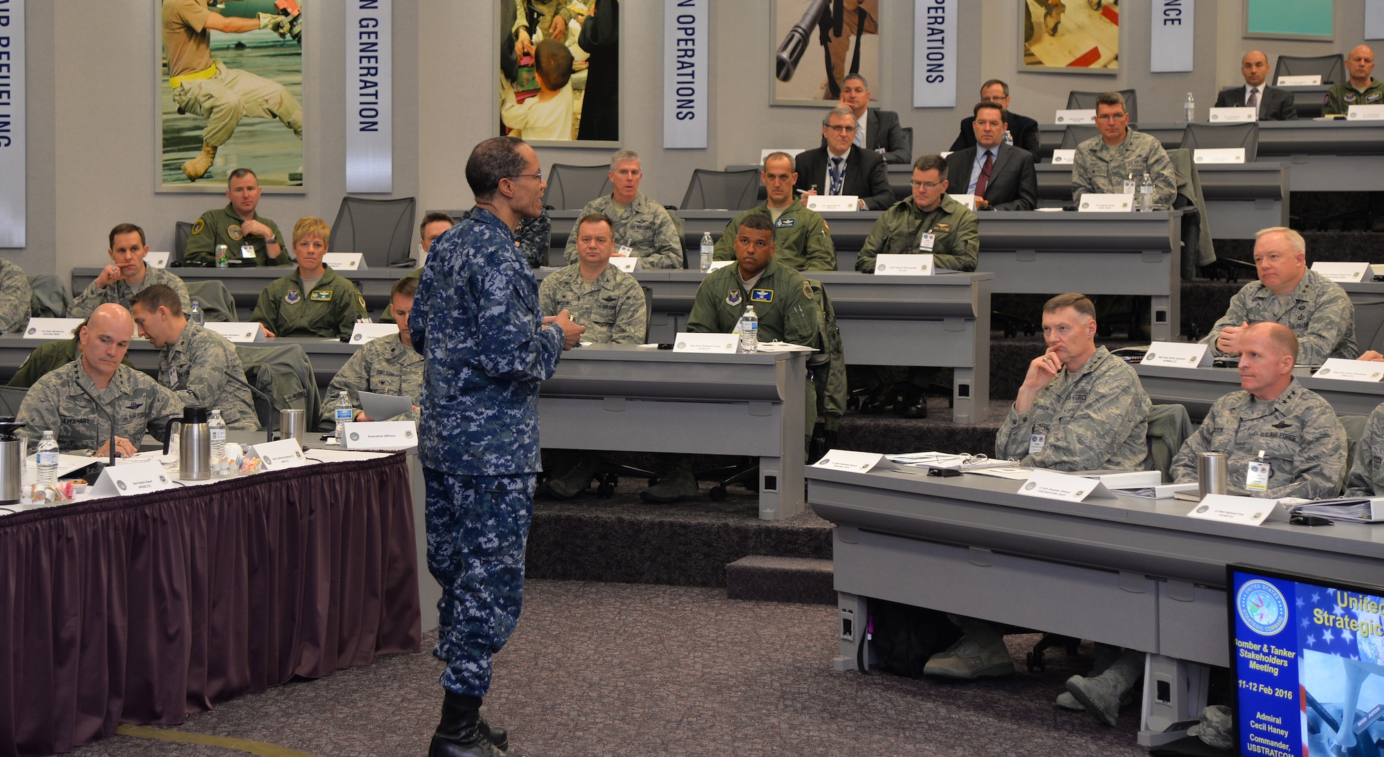 U.S. Navy Adm. Cecil D. Haney (standing), U.S. Strategic Command (USSTRATCOM) commander, provides the opening remarks during USSTRATCOM's Bomber and Tanker Stakeholders Conferences at Scott Air Force Base, Ill., Feb. 11, 2016. Haney chaired the two-day event, during which he, U.S. Air Force Gen. Robin Rand (not pictured), Air Force Global Strike Command (AFGSC) commander; U.S. Air Force Gen. Carlton D. Everhart (seated left), Air Mobility Command commander; and other general officers held discussions with AFGSC wing commanders and deputy commanders as part of their continuing collaborative effort to together develop the next generation of leaders. These recurring forums are designed to assess the health and direction of the nation's strategic forces, including ICBM, ballistic missile submarine, bomber and supporting tanker forces, as well as sensors and communication networks. One of nine DoD unified combatant commands, USSTRATCOM has global strategic missions, assigned through the Unified Command Plan, which include strategic deterrence; space operations; cyberspace operations; joint electronic warfare; global strike; missile defense; intelligence, surveillance and reconnaissance; combating weapons of mass destruction; and analysis and targeting. (U.S. Air Force photo by Master Sgt. Thomas J. Doscher) 
