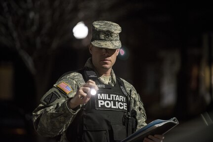 Staff Sgt. Micheal Deitz, patrol supervisor for the 289th Military Police Company, belonging to the 3rd U.S. Infantry Regiment (The Old Guard), inspects his vehicle before the start of his patrol in the Military District of Washington, D.C., Feb. 17. The 289th MP Co. is currently operating a partnership with U.S. Army Reserve MP Soldiers from the 200th MP Command as part of a pilot program that began in early February, placing Army Reserve MPs on active duty orders for three weeks while working at Joint Base Myer-Henderson Hall, Fort Lesley J. McNair and the Arlington National Cemetery. Soldiers will also support the Military District of Washington with additional duty days throughout the year. (U.S. Army photo by Master Sgt. Michel Sauret)