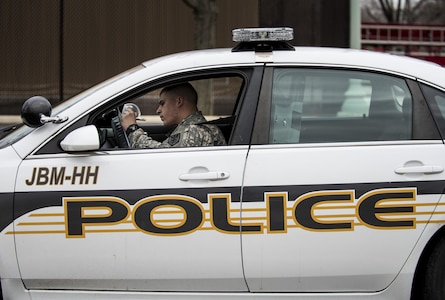 Spc. Anthony Petry, U.S. Army Reserve military police Soldier from 374th MP Company, of the 200th MP Command, from Taneytown, Md., conducts some paperwork during a patrol shift at Fort Lesley J. McNair, Va., during a partnership training program with active duty Soldiers from the 289th MP Co., belonging to the 3rd U.S. Infantry Regiment (The Old Guard), to provide law and order, security and patrol support at various active duty installations in the Military District of Washington, D.C., Feb. 17. This partnership pilot program began in early February, placing Army Reserve Soldiers on active duty orders for three weeks while working at Joint Base Myer-Henderson Hall, Fort Lesley J. McNair and the Arlington National Cemetery. Soldiers will also support the Military District of Washington with additional duty days throughout the year. (U.S. Army photo by Master Sgt. Michel Sauret)