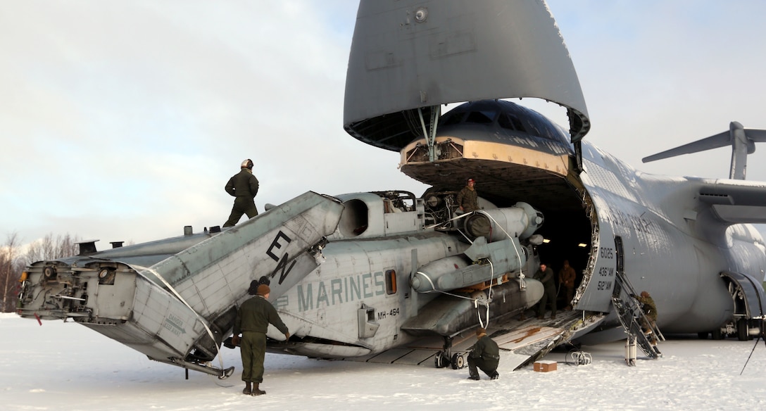 Marines from Marine Heavy Helicopter Squadron 464 (-) Reinforced off-load a CH-53E from a C-5 Feb. 15, 2016, in Vӕrnes, Norway, in preparation for Exercise Cold Response 2016. The exercise will include12 NATO allies and partner nations, and approximately 16,000 troops. The helicopters add to the growing number of Marine Corps ground and aviation assets filtering into the country in support of the exercise.