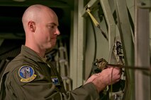 U.S. Air Force Reserve Master Sgt. Tim Brown, a loadmaster assigned to the 327th Airlift Squadron, ties down equipment during a preflight inspection in a C-130J fuselage trainer at the U.S. Air Force C-130 Aircrew Training System schoolhouse at Little Rock Air Force Base, Ark., Feb. 16, 2016. Before taking off, loadmasters secure any equipment that might fall out of the aircraft during an airdrop mission. (U.S. Air Force photo by Master Sgt. Jeff Walston/Released)