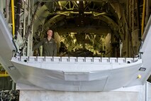 U.S. Air Force Reserve Master Sgt. Tim Brown, a loadmaster assigned to the 327th Airlift Squadron, tests the ramp and door system of a C-130 fuselage trainer (FuT) at the U.S. Air Force C-130 Aircrew Training System schoolhouse at Little Rock Air Force Base, Ark., Feb. 16, 2016. The 913th Airlift Group is transitioning from the C-130H Hercules to the C-130J Super Hercules, and aircrew personnel from the group use the FuT for retraining and certification on the new airframe. (U.S. Air Force photo by Master Sgt. Jeff Walston/Released)