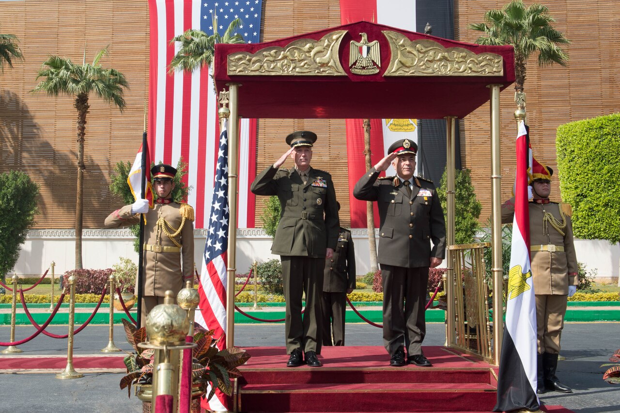 Marine Corps Gen. Joseph F. Dunford Jr., chairman of the Joint Chiefs of Staff, and Egyptian Chief of the Armed Forces Lt. Gen. Mahmoud Hegazy, right, render honors during an honor cordon at the Egyptian Ministry of Defense in Cairo, Feb. 20, 2016. DoD photo by D. Myles Cullen